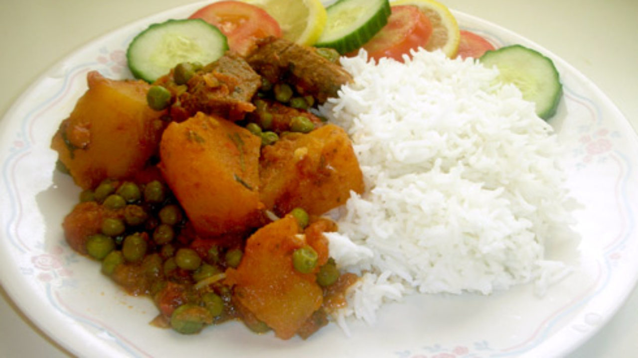 Beef Stew With Green Peas And Potato Served With Rice